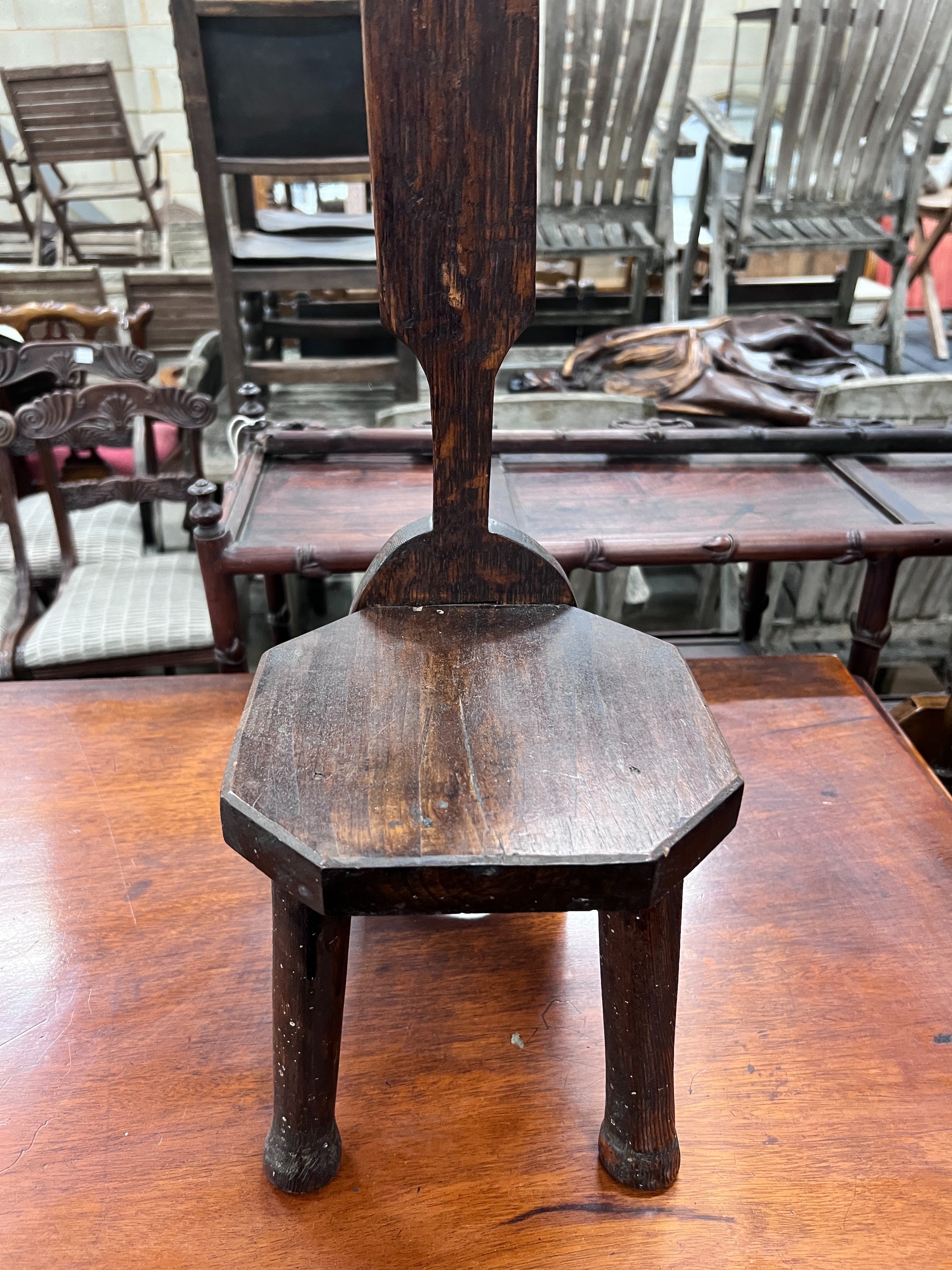 A carved oak spinning chair, height 82cm *Please note the sale commences at 9am.